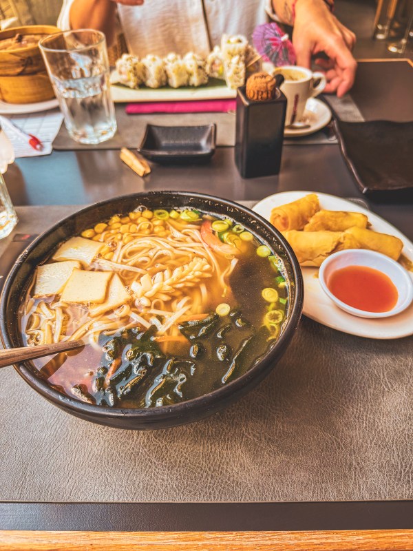 Several dishes and drinks arranged across a restaurant table.