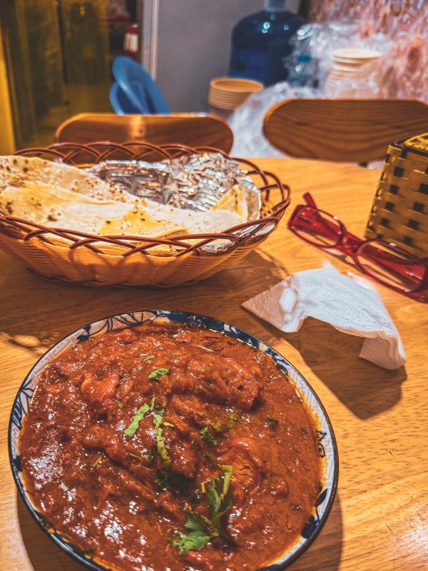 A dish served on a table with flatbread in Hanoi.