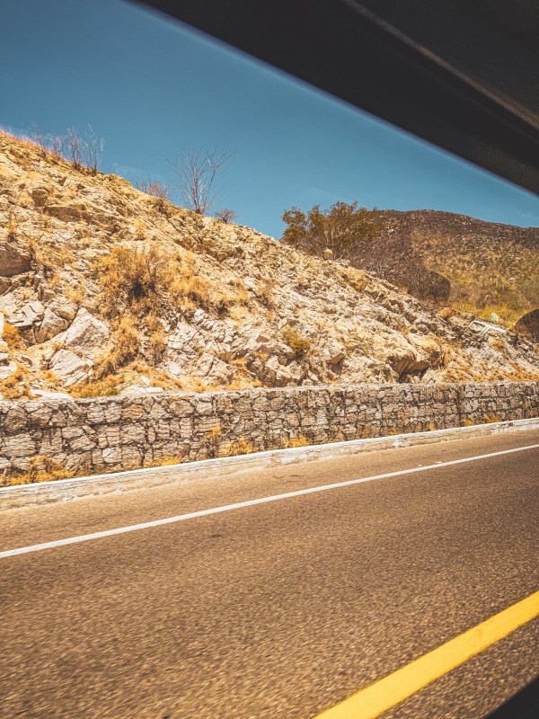 A road beside a rocky slope in Los Cabos.