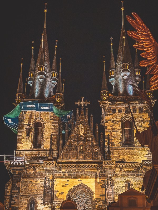 Illuminated towers against the night sky in Prague.