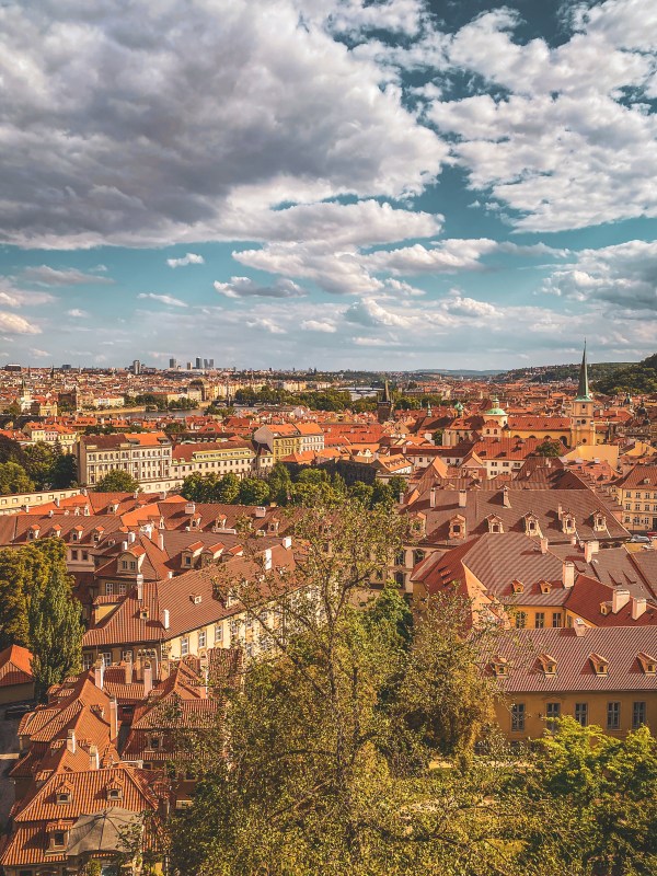 A view across Prague’s red rooftops from the castle steps.