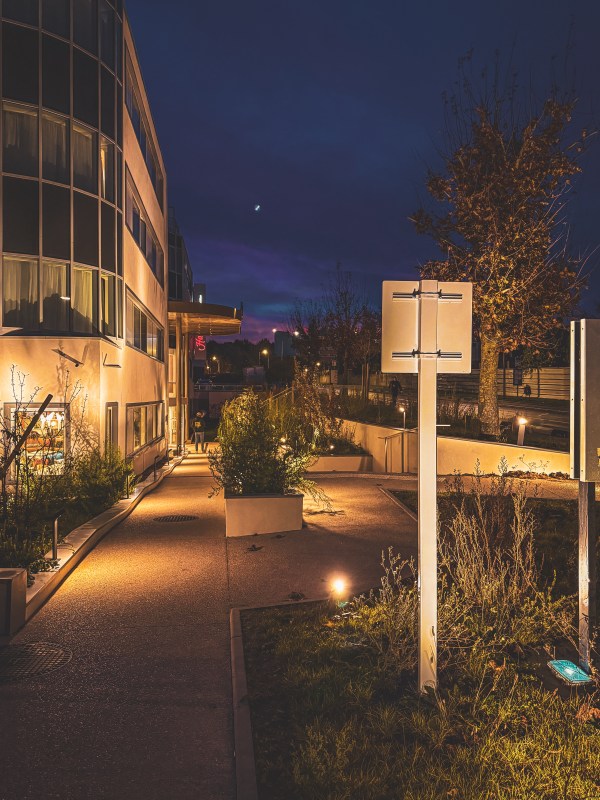 Modern building illuminated at night in Roissy-en-France.