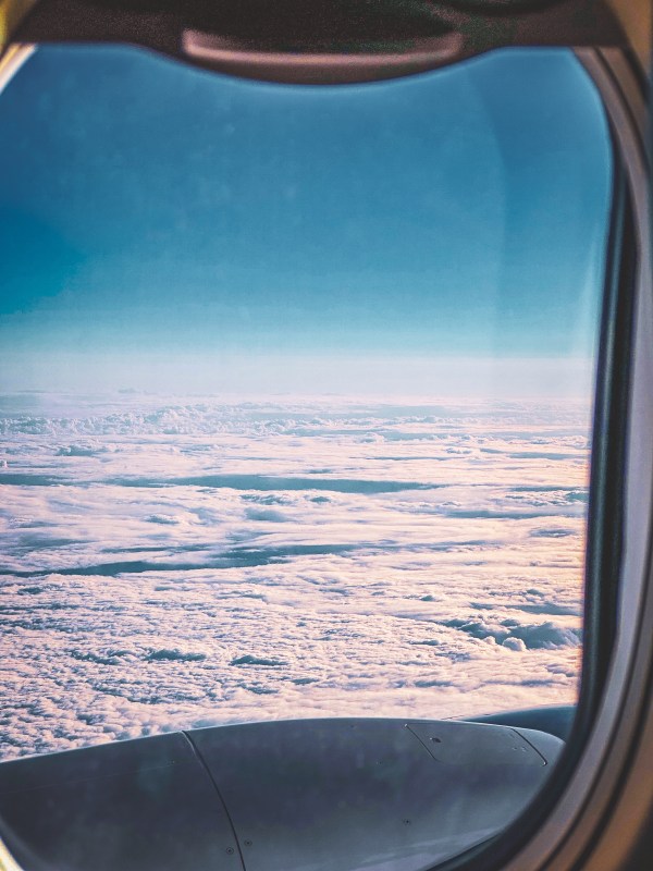 Clouds seen through an aircraft window.