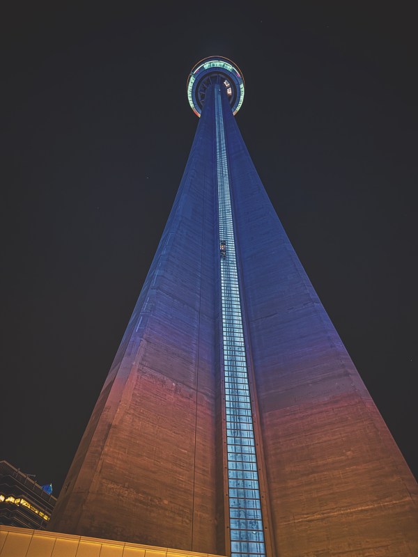 CN Tower illuminated against the night sky.