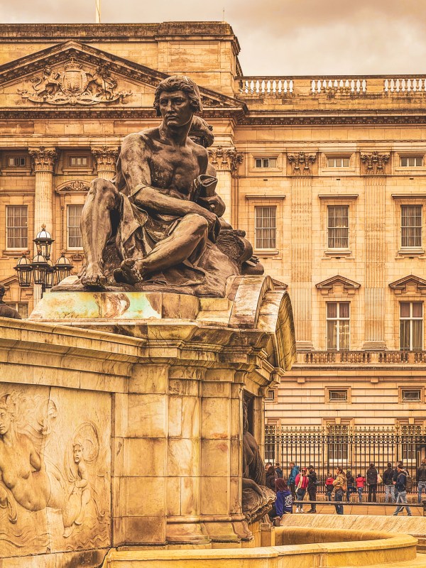 Sculpted figure beside Buckingham Palace.